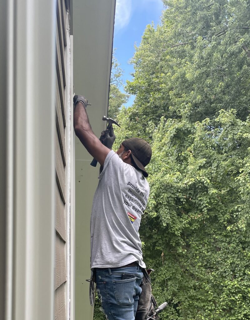Renewal by Andersen installation crew installs replacement windows.