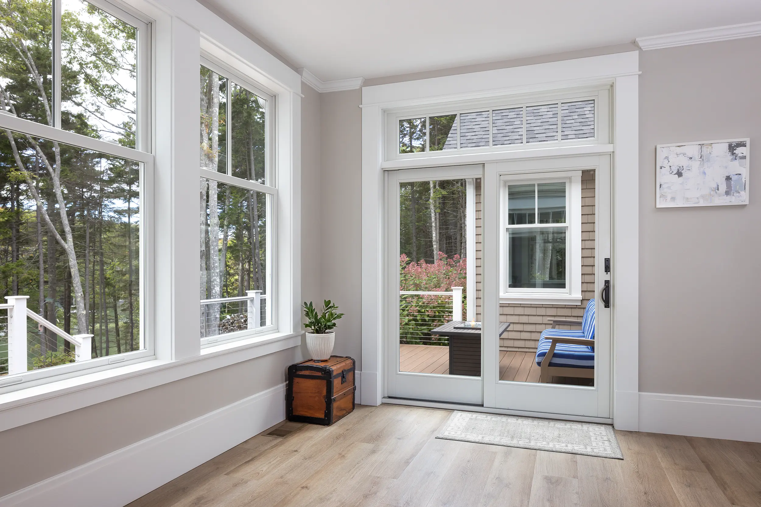 Glass sliding patio door leading to a porch
