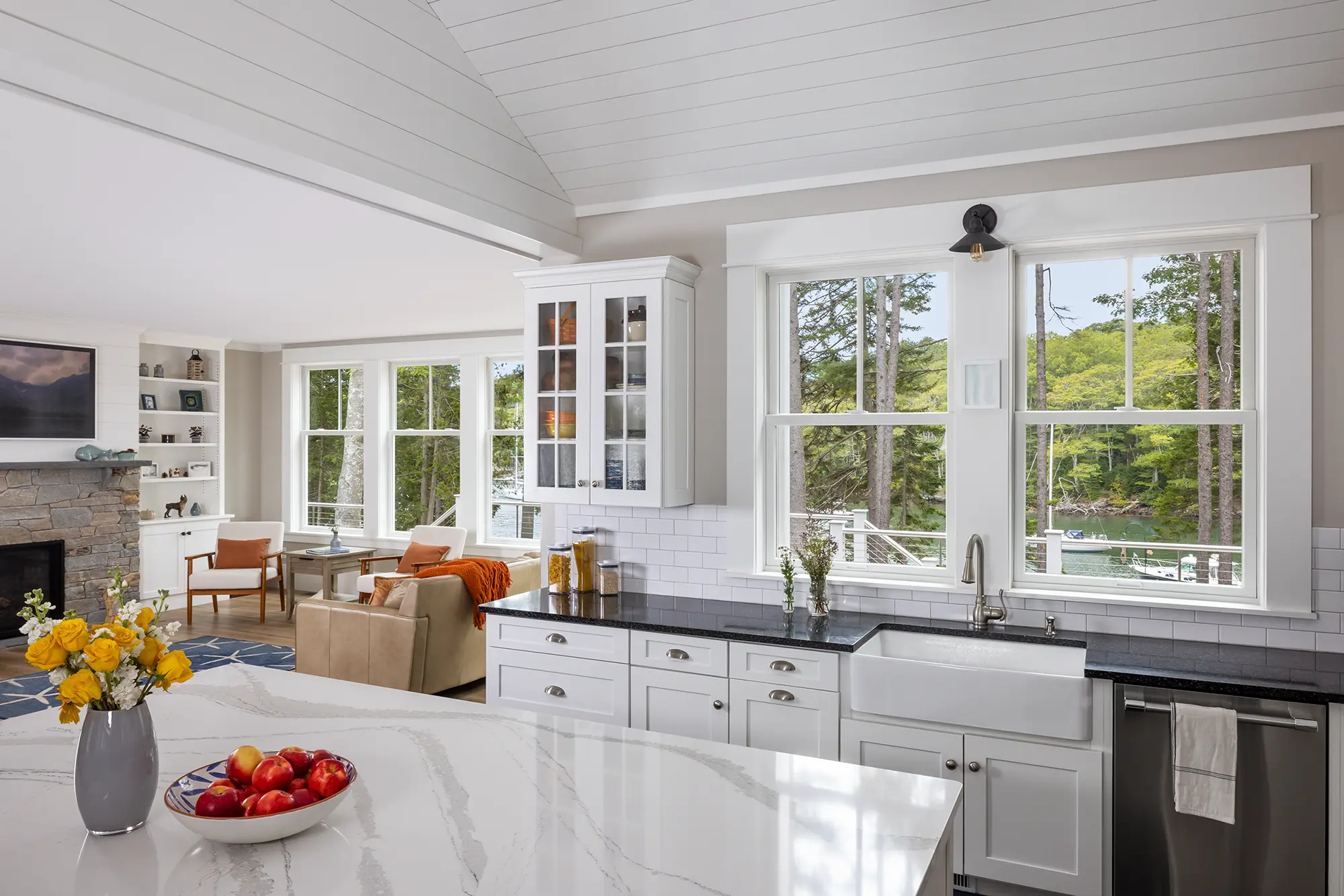 White kitchen with two windows above the sink