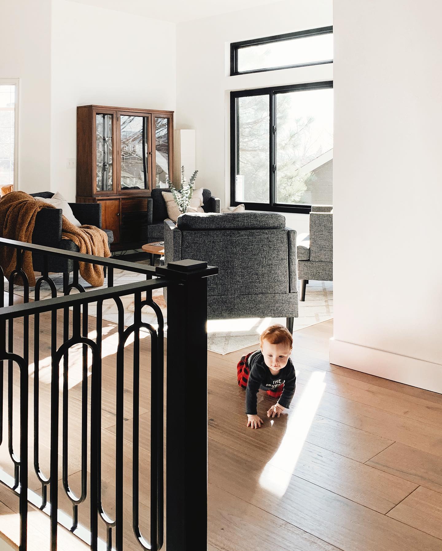 Baby crawling on floor in living room