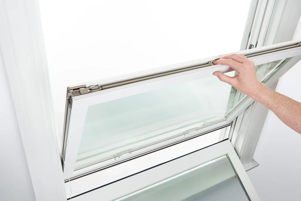 Hand opening a window