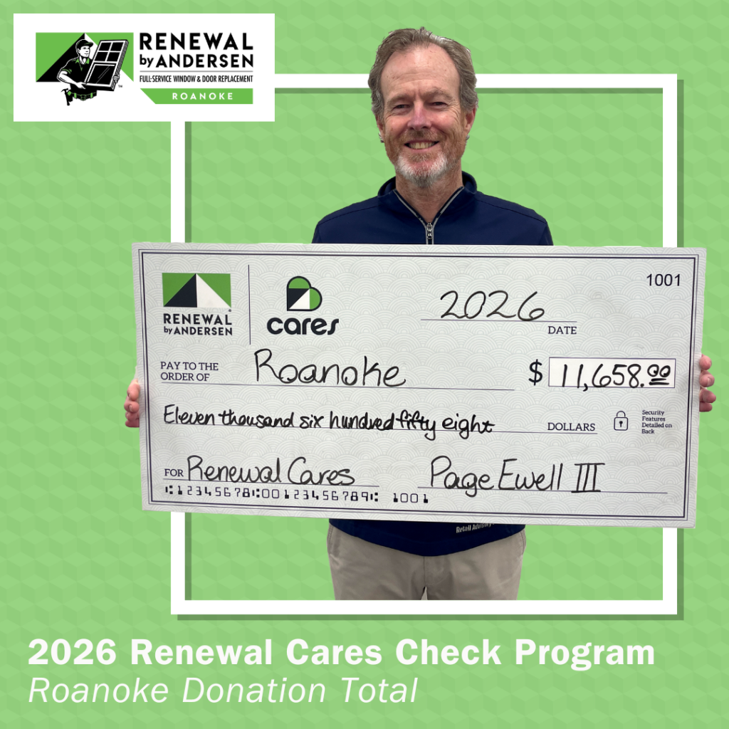 Page Ewell III holding a giant check.