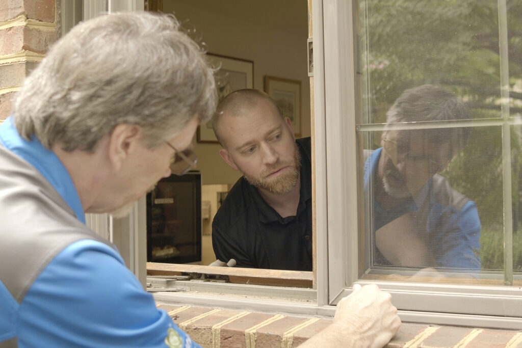 Renewal by Andersen of Roanoke measures a window at Ronald McDonald House