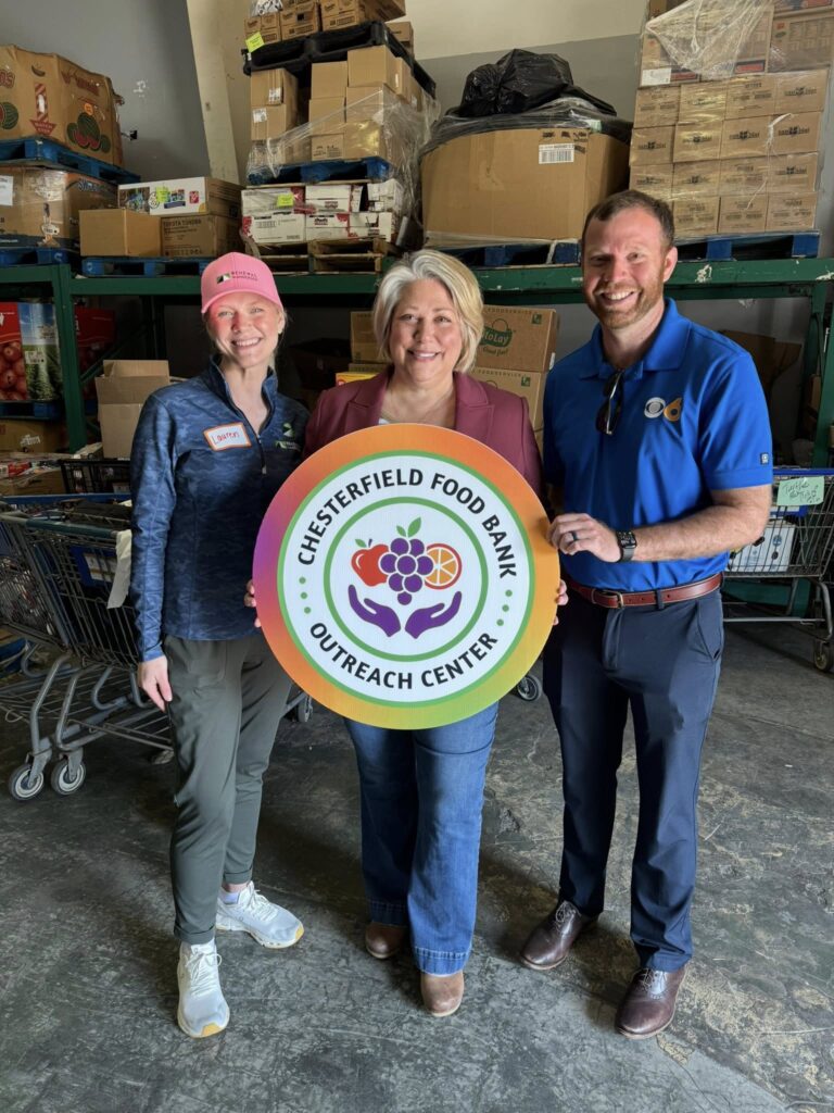 Lauren Muse stands with Chesterfield Food Bank manager and CBS 6 employee