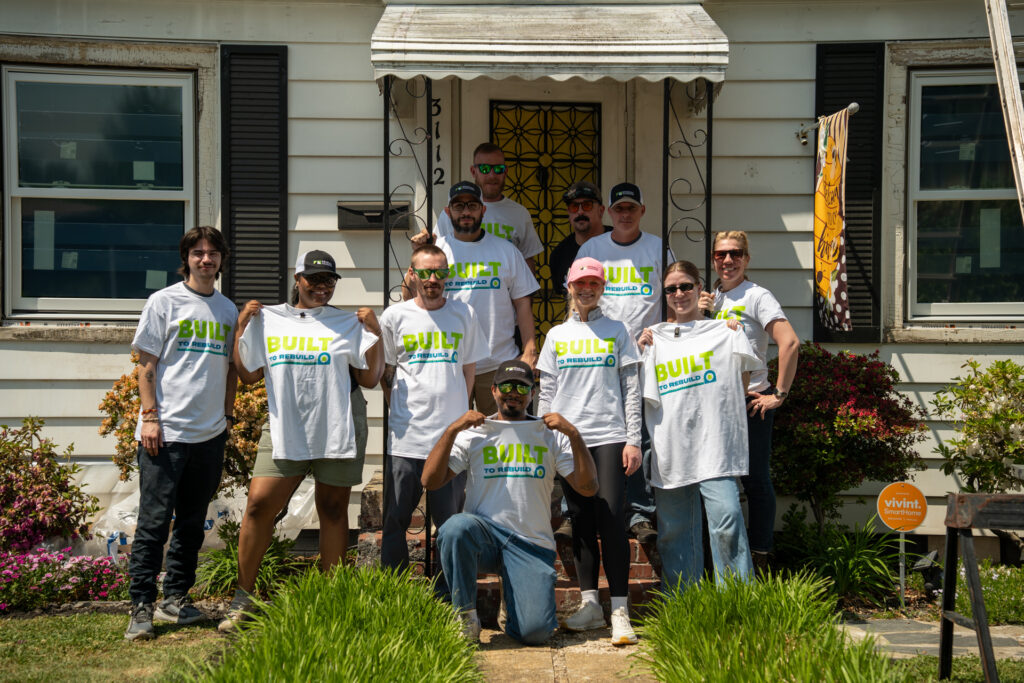 Renewal by Andersen group photo wearing Built to Rebuild shirts.