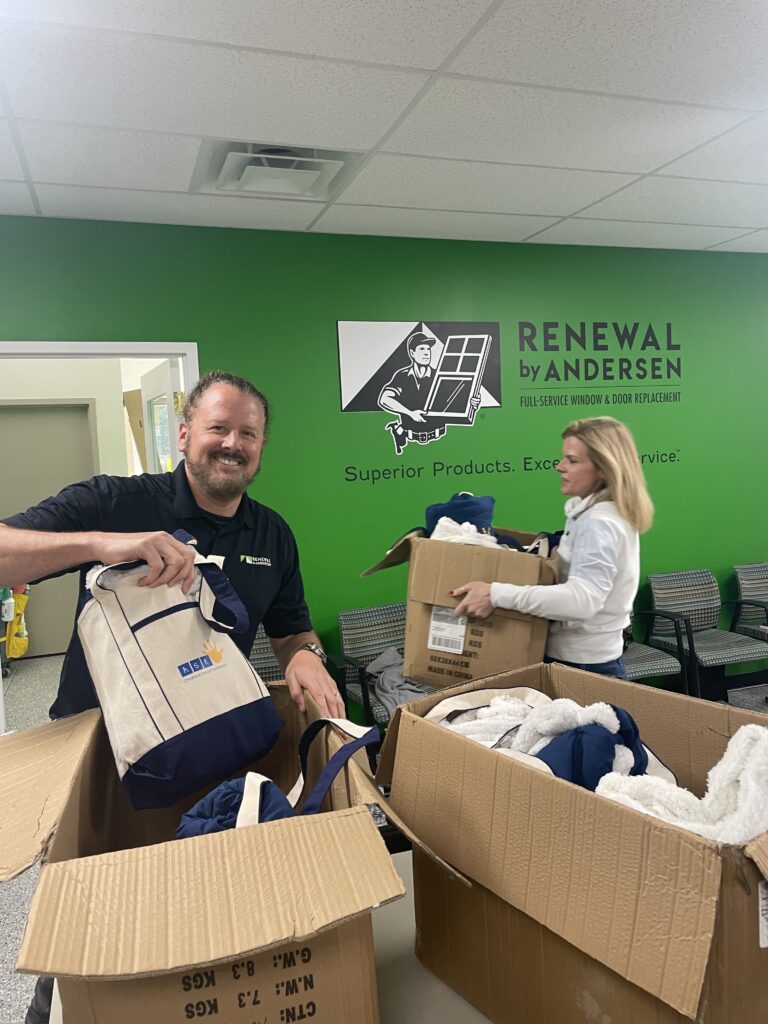 Renewal by Andersen of Central Virginia sales team members packing bags for ASK Childhood Cancer Foundation