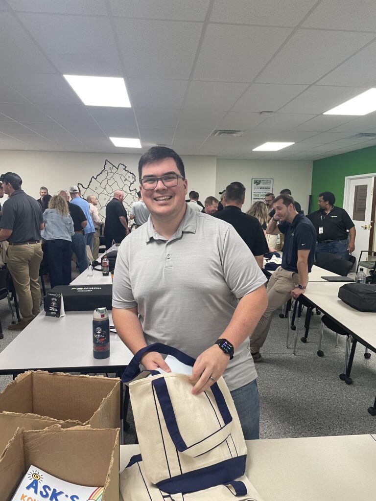 Renewal by Andersen of Central Virginia sales team members packing bags for ASK Childhood Cancer Foundation