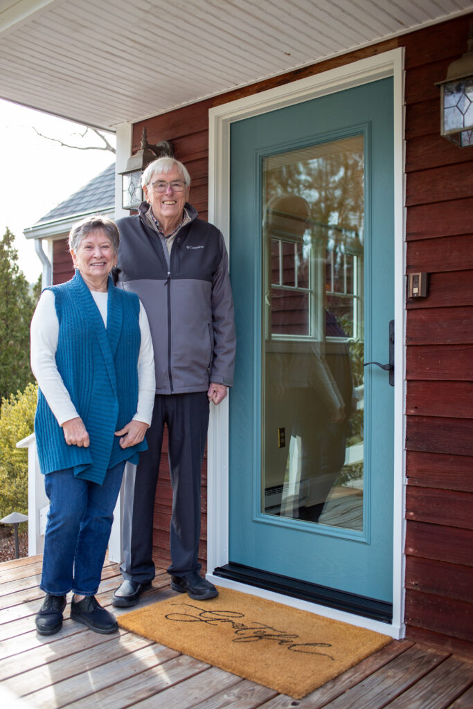 Homeowners with brand new Ensemble entry door from Renewal by Andersen
