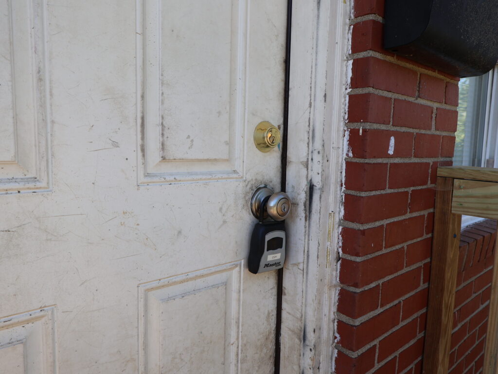 Previous door, close up on damage, scrapes, dirt marks, broken seal, etc.