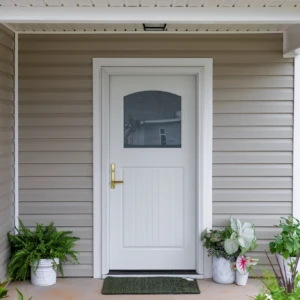 White entry door on tan house