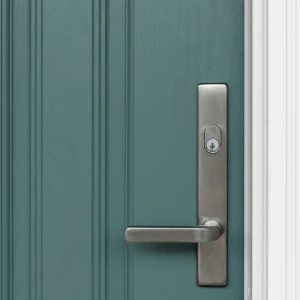 Silver door handle on turquoise door