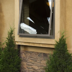 Awning window opening to outside on yellow house