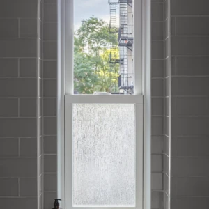 Double hung window in a shower