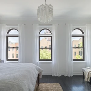 Black double hung windows in a bedroom