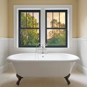 Black double hung windows with white trim in a bathroom