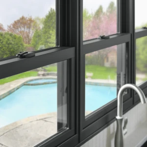 Black double hung windows above a sink